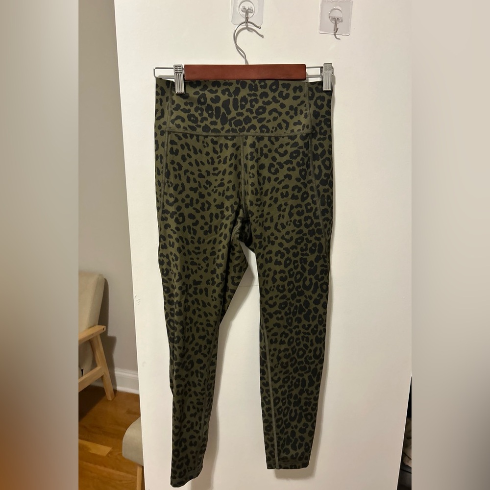 Gap cheetah print laser cut green leggings.